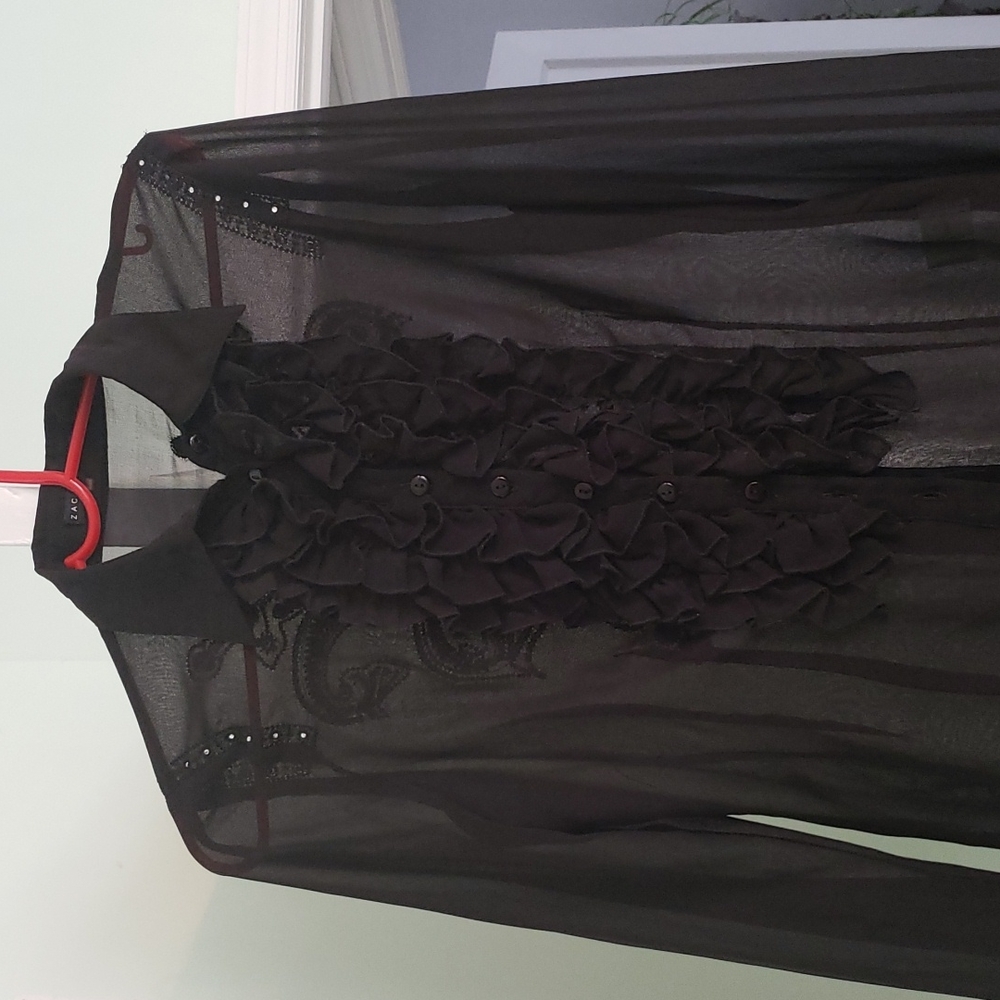 A Silky black Zac Studio blouse with detailed embroidery.